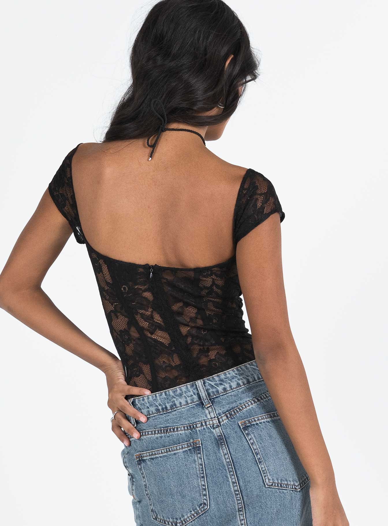 back view of model wearing Princess Polly Cadrot Lace Bodysuit Black Short Sleeve 