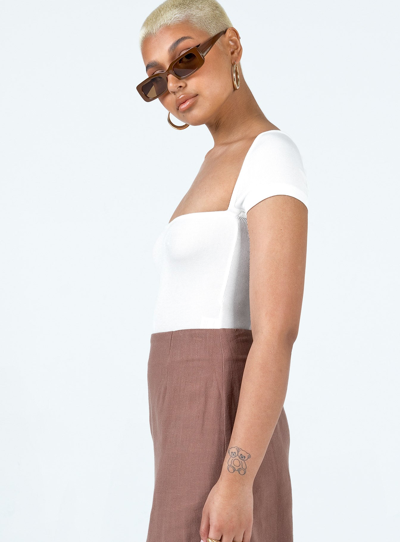 side view of model wearing Princess Polly Langley Bodysuit White Short Sleeves Square Neck 