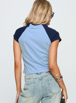 back view of model wearing Princess Polly South West Sports Graphic Top Blue Short Sleeves Crew Neck 