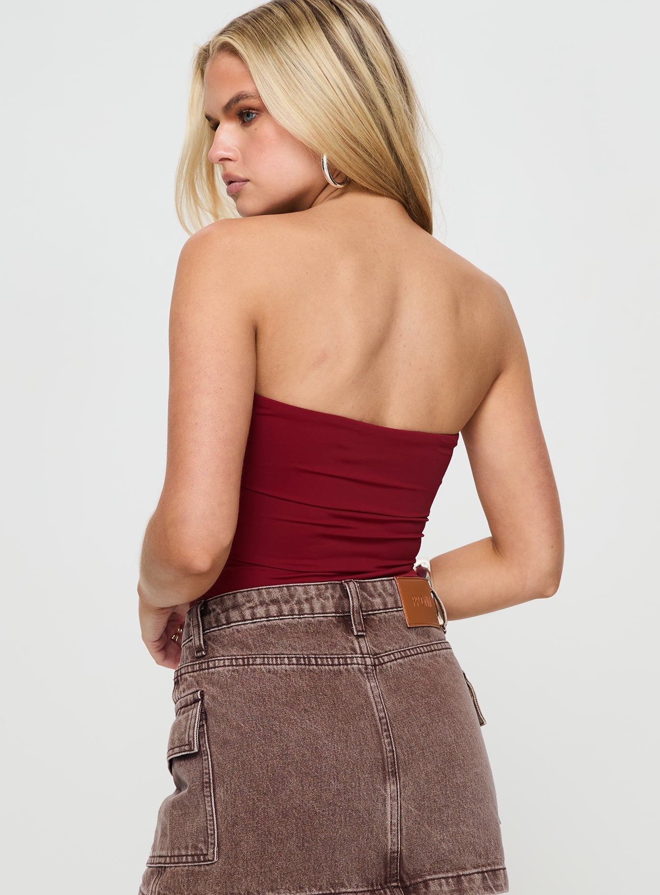 back view of model wearing Princess Polly Niner Strapless Bodysuit Burgundy Sleeveless 
