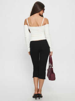 back view of model wearing Princess Polly Baseline Rib Capri Pants Black High Rise Pants 