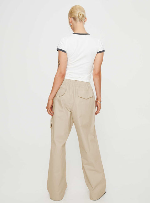 Front view of model wearing  front Princess Polly High Waisted Pants  Isadore Cargo Pants Beige