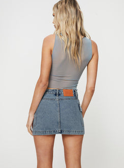 back view of model wearing Princess Polly Zakai Cargo Denim Mini Skirt Light Blue Denim Petite Mini Skirts 