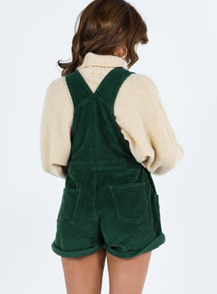 Khaki overalls Cord material  Adjustable shoulder straps  Button fastening at hips  Chest pocket 