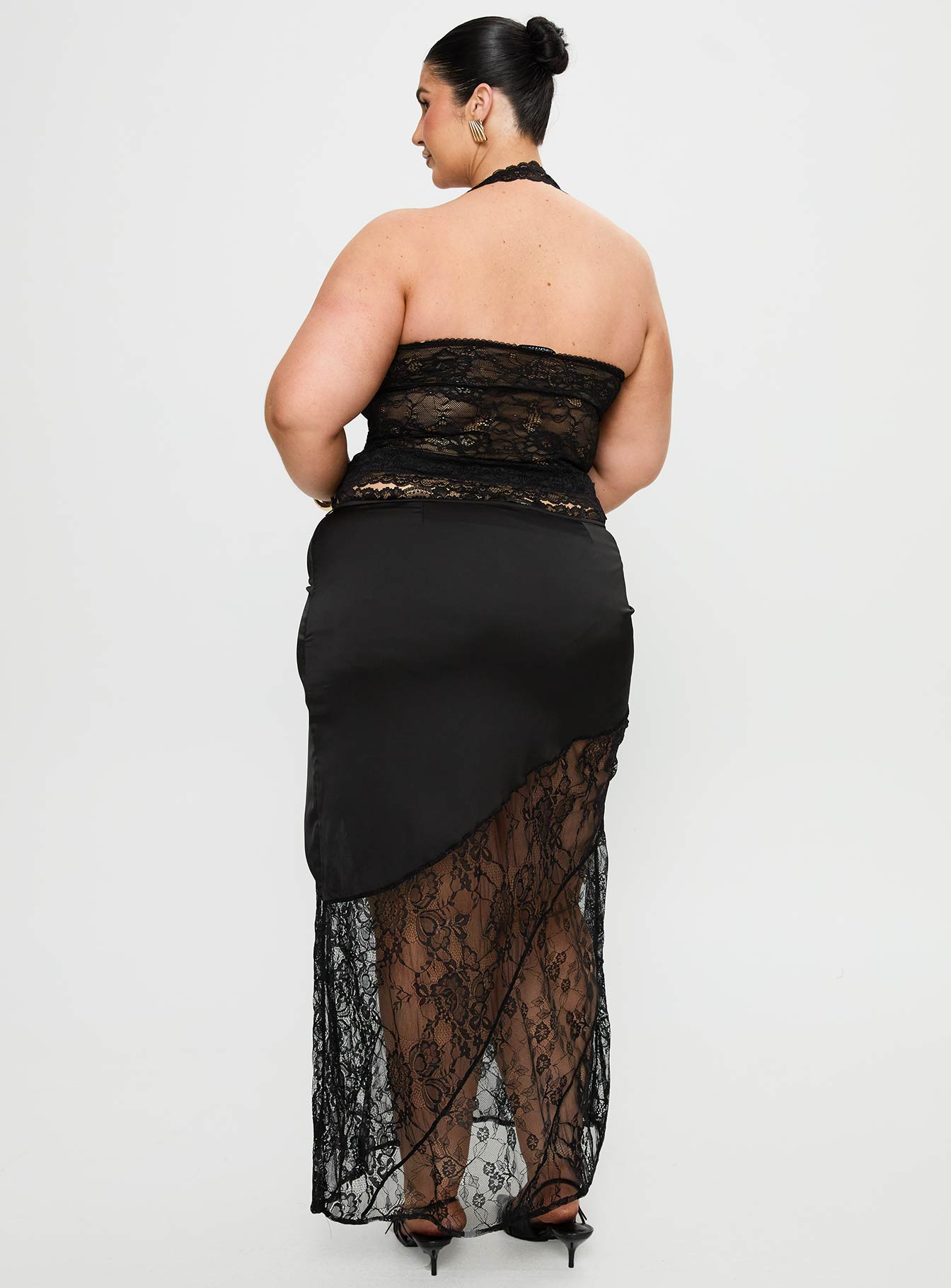 back view of model wearing Princess Polly Castelli Lace Maxi Skirt Black Curve Maxi 