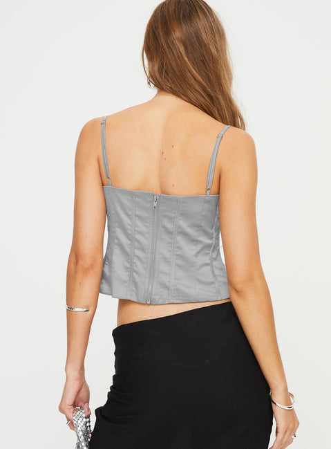 Satin bustier top Adjustable shoulder straps, sweetheart neckline, boning through front, zip fastening at back Non-stretch material, fully lined 