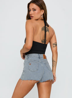 back view of model wearing Princess Polly Make My Day Mid Rise Denim Skort Light Wash High Waisted Shorts 