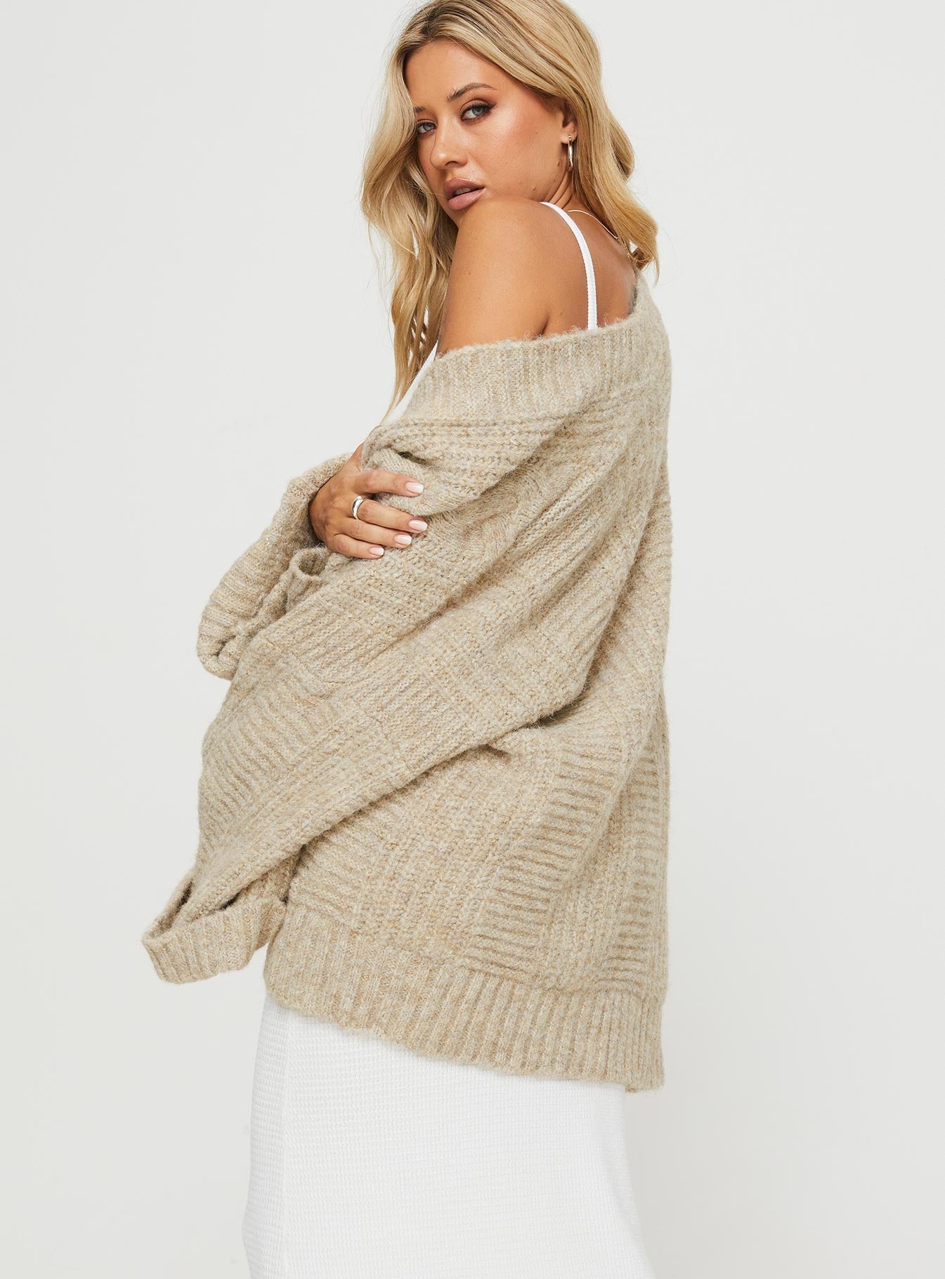 back view of model wearing Princess Polly Paisleigh Cable Knit Cardigan Beige 