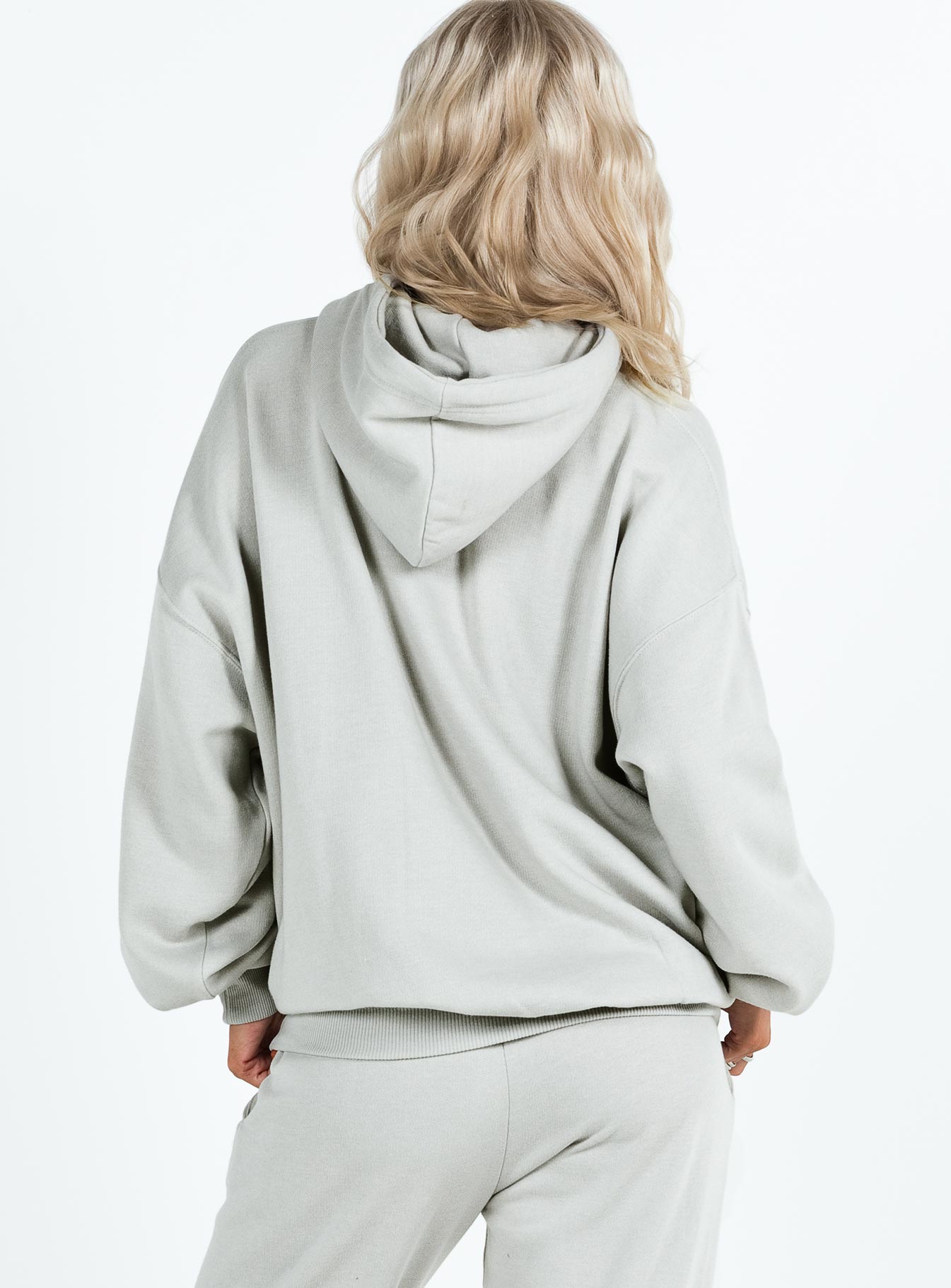 back view of model wearing Princess Polly Princess Polly Hooded Sweatshirt Cursive Text Grey / Blue regular 
