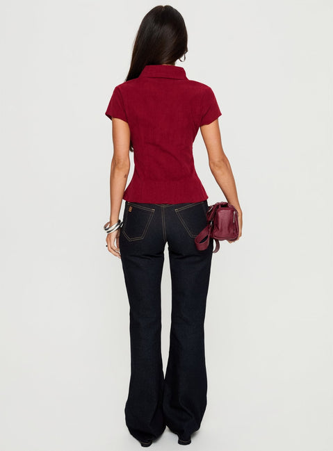 back view of model wearing Princess Polly Magic Mirror Mid Rise Bootleg Jeans Raw Indigo Mid Rise Jeans Jeans 