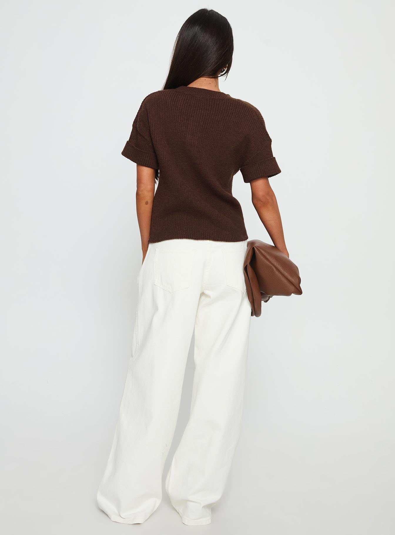 back view of model wearing Princess Polly Ramos Low Rise Wide Leg Jeans White Low Rise Jeans 