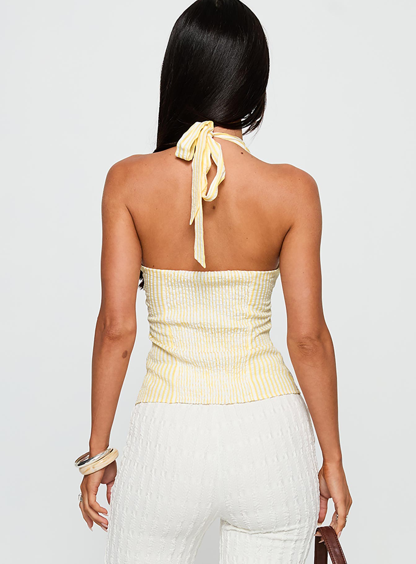 back view of model wearing Princess Polly Old Friend Halter Top Yellow Stripe Sleeveless V-Neck 