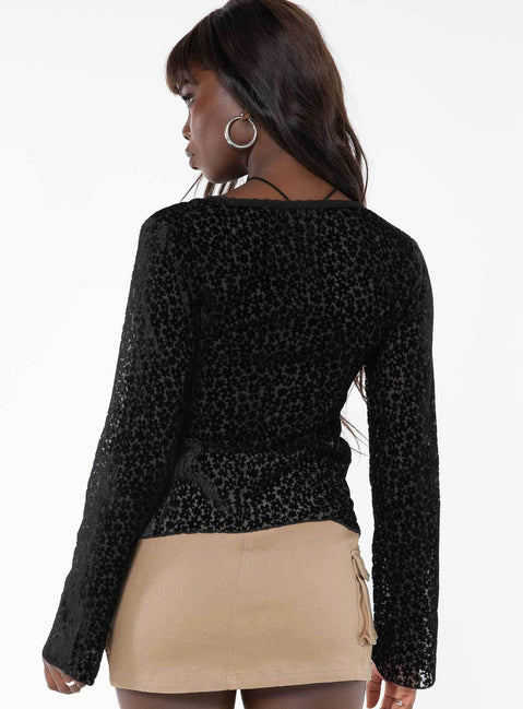 Long sleeve top, v-neckline Button fastening at front, split hem, lace trim