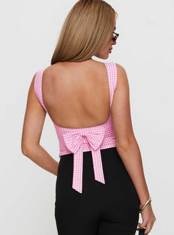back view of model wearing Princess Polly Monterrey Backless Bow Detail Top Pink Gingham Sleeveless Boat Neck 