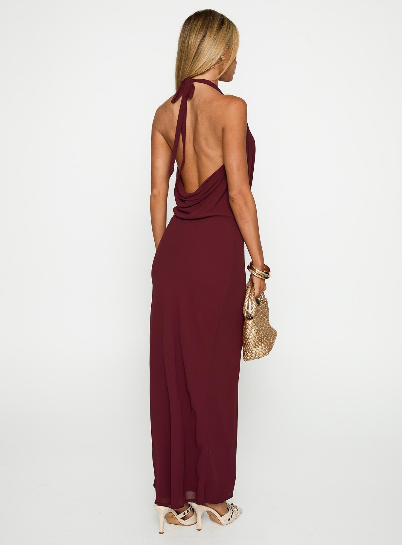 back view of model wearing Princess Polly Vortexa Halter Maxi Dress Currant Plunger 