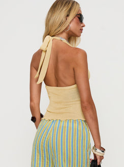 back view of model wearing Princess Polly Leam Top Butter Sleeveless Plunger 