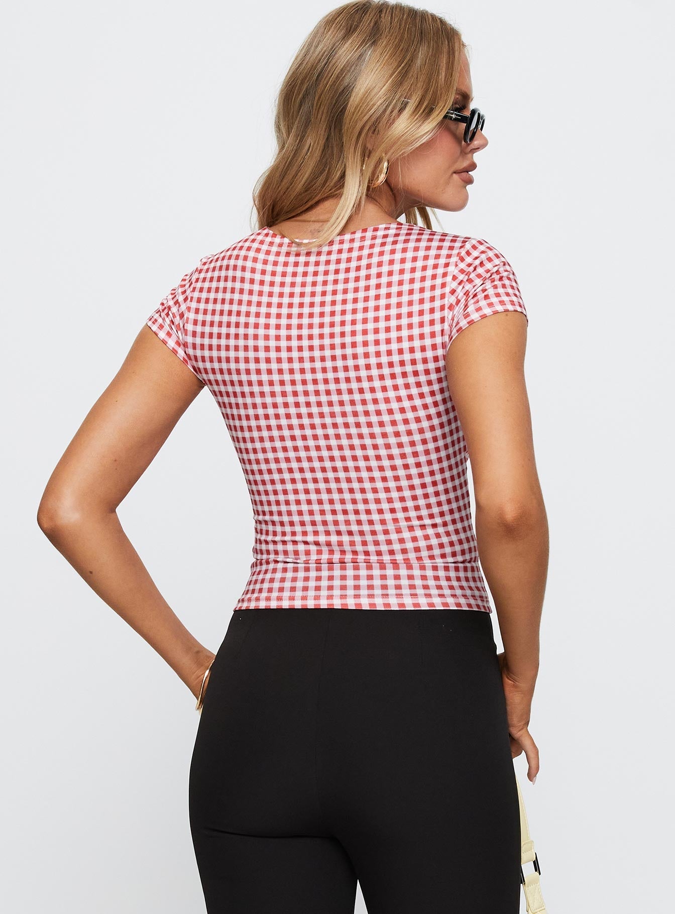 back view of model wearing Princess Polly Marcello Graphic Top Red Check Sleeveless Crew Neck 