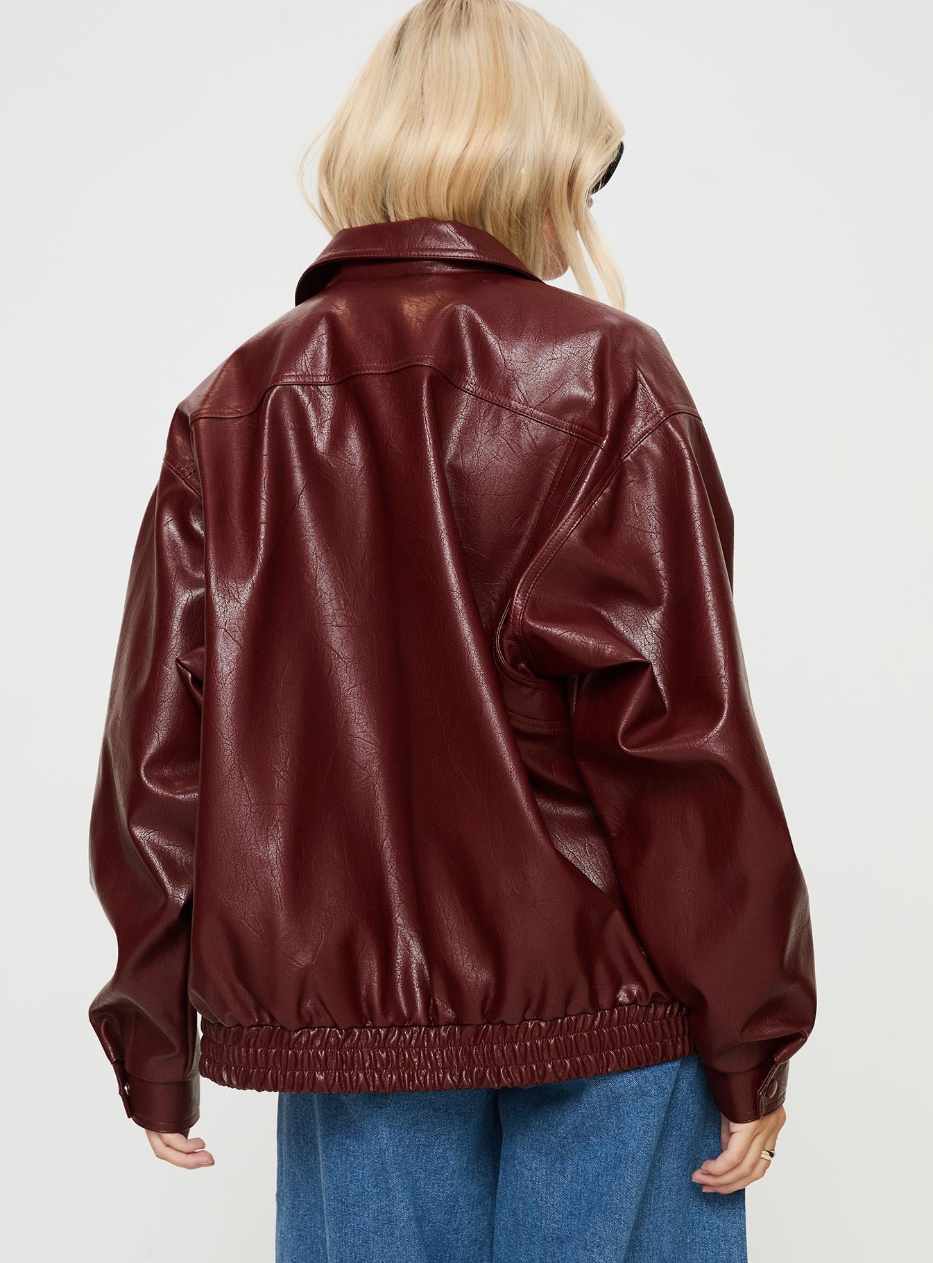 Burgundy Faux Leather jacket Oversized fit, zip fastening at front, classic collar, twin hip pockets, elasticated waistband