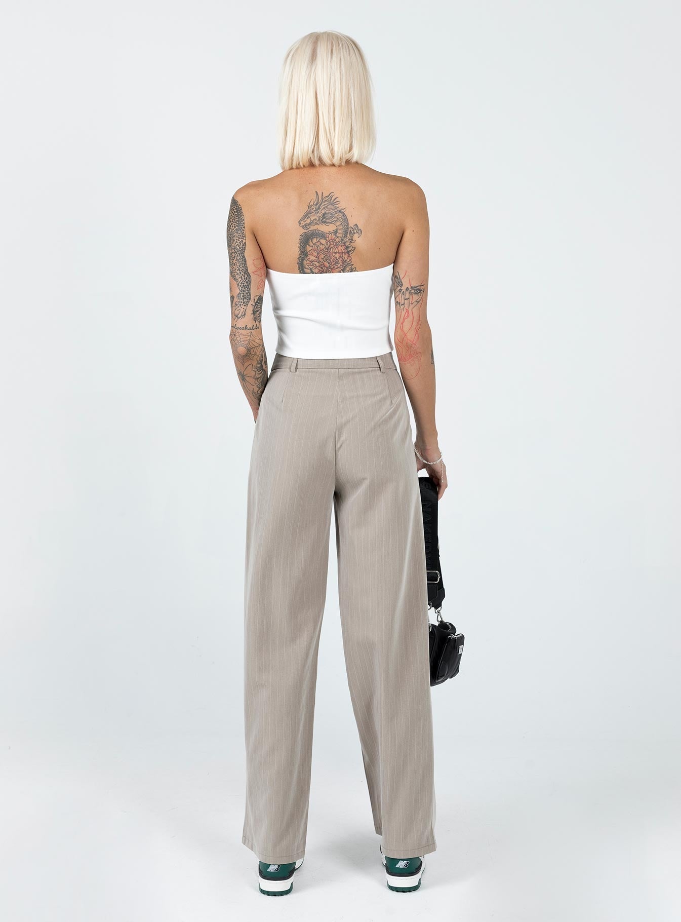 Front view of model wearing  front Princess Polly High Waisted Pants  Archer Pants Pinstripe Beige