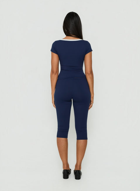 View the Rowanna Sporty Capri Pants Navy / Cream womens-regular-pants in high-rise back view of model wearing