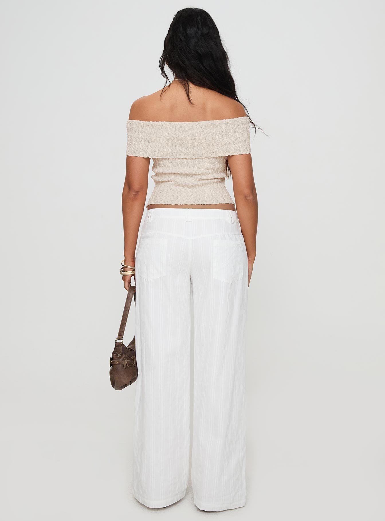 back view of model wearing Princess Polly Vendi Low Rise Pant White Petite Low Rise Pants 