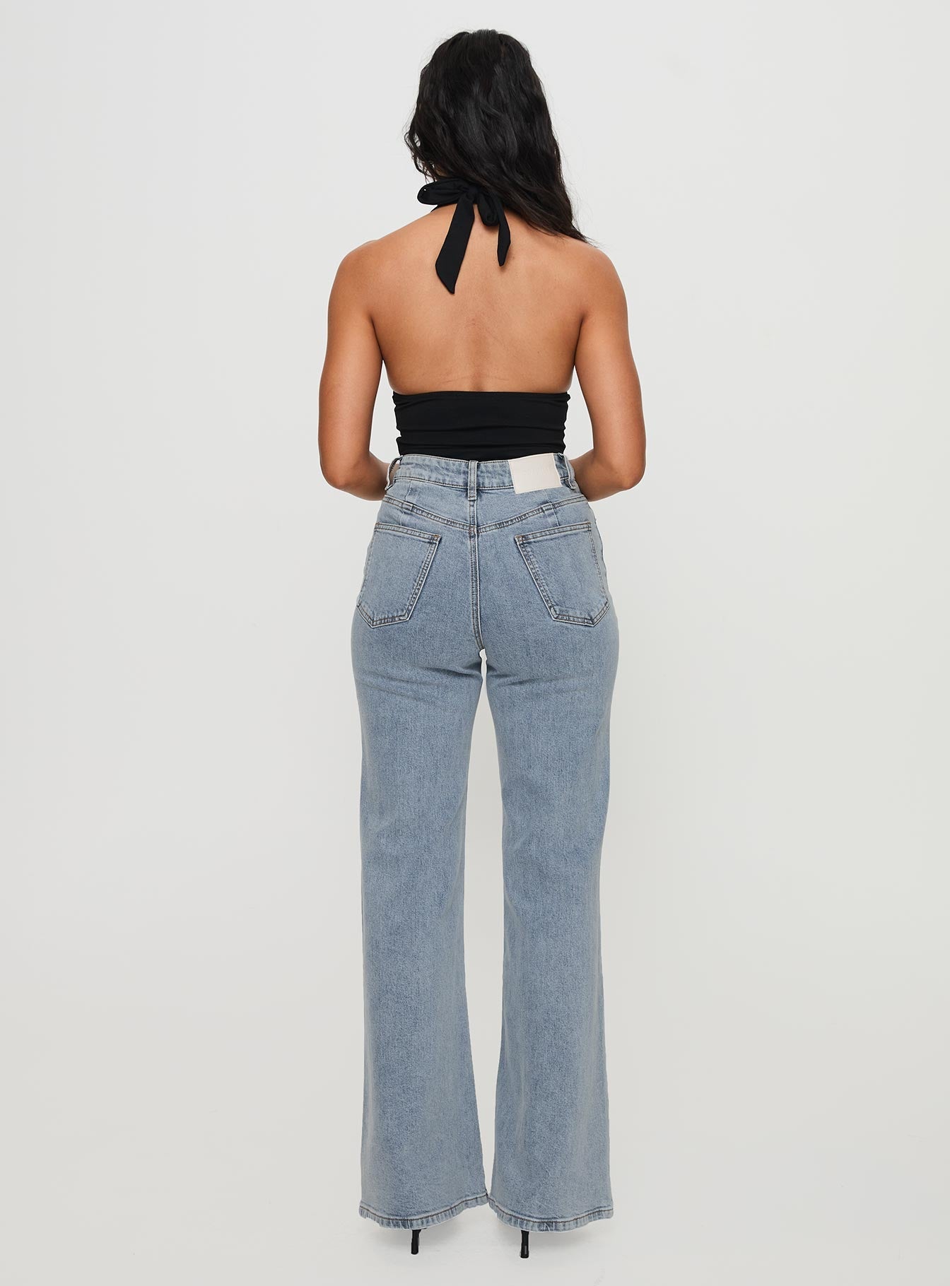 back view of model wearing Princess Polly Thearlie High Flare Jean Light Wash High Waisted 