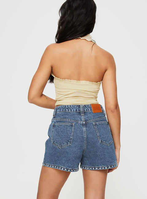 Denim shorts High rise fit, silver studded detailed, classic five pocket design, belt loops at waist, zip and button fastening, branded patch at back