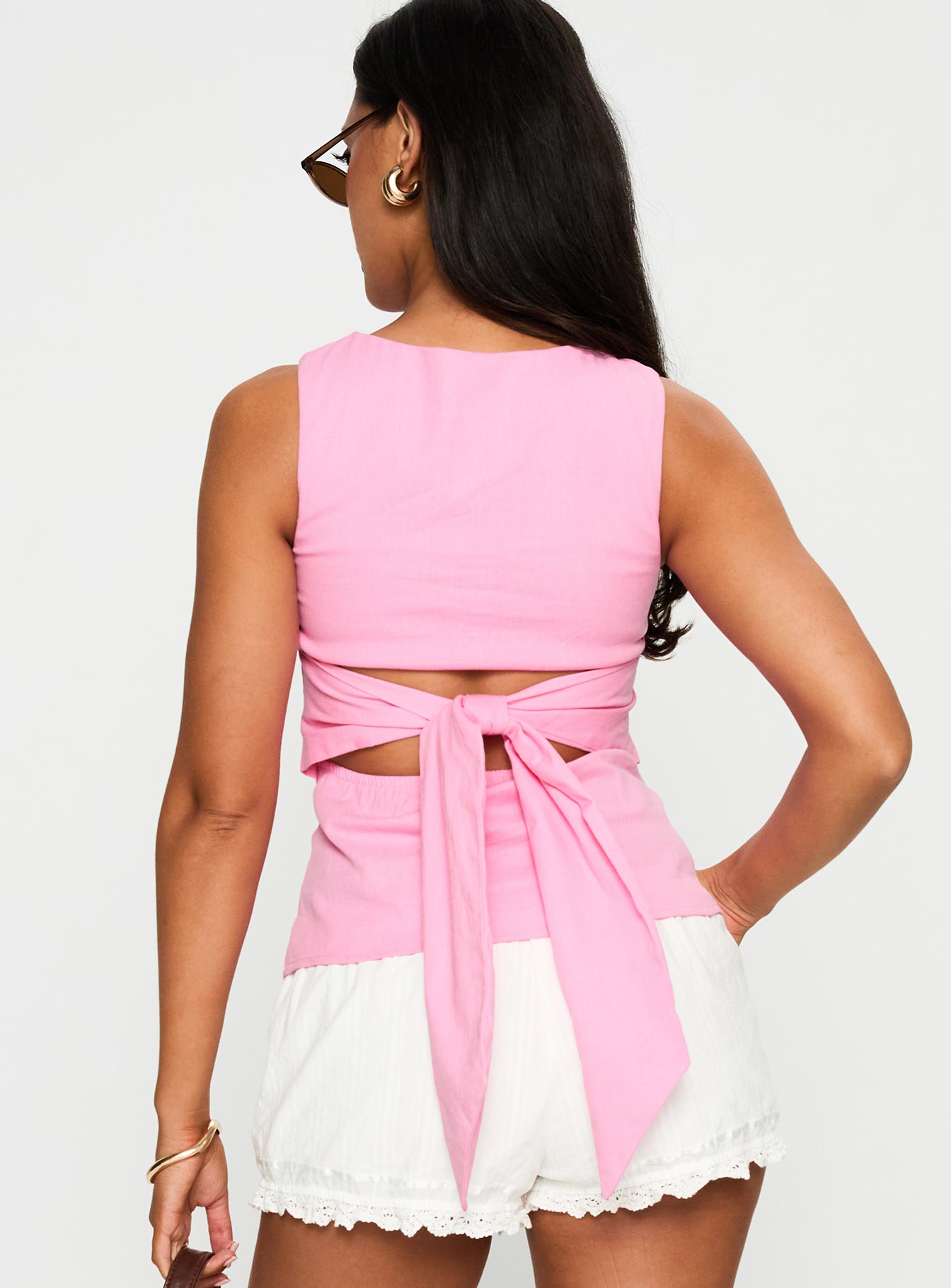 back view of model wearing Princess Polly Michaud Top Pink Sleeveless Crew Neck 