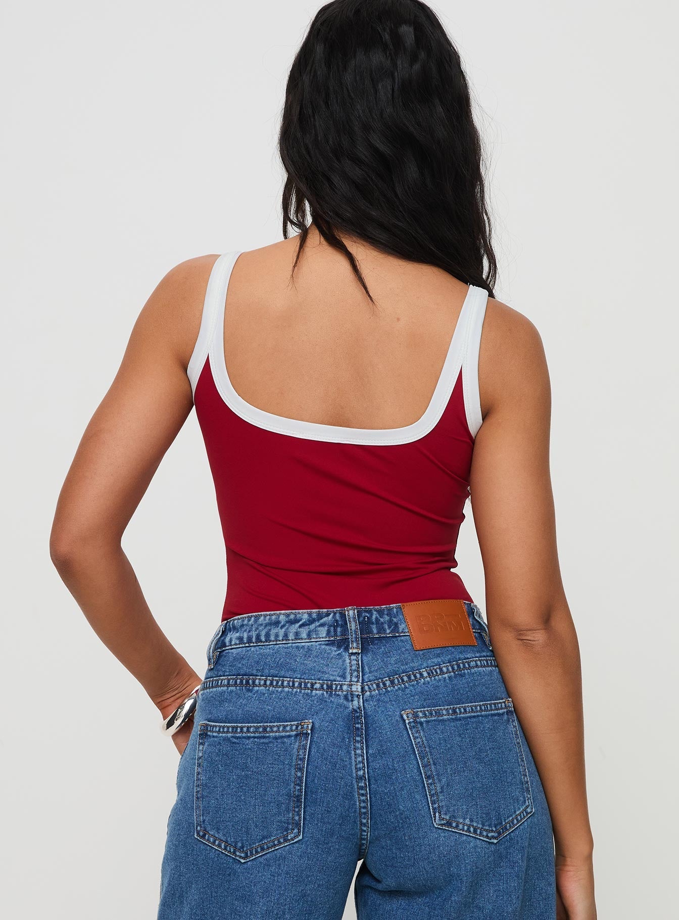 back view of model wearing Princess Polly Astrea Bodysuit Red / White Sleeveless Scoop Neck 