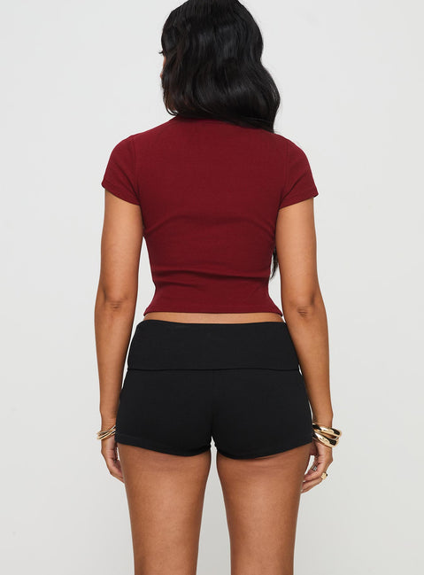 back view of model wearing Princess Polly Baseline Low Rise Rib Shorts Black High Waisted Shorts 