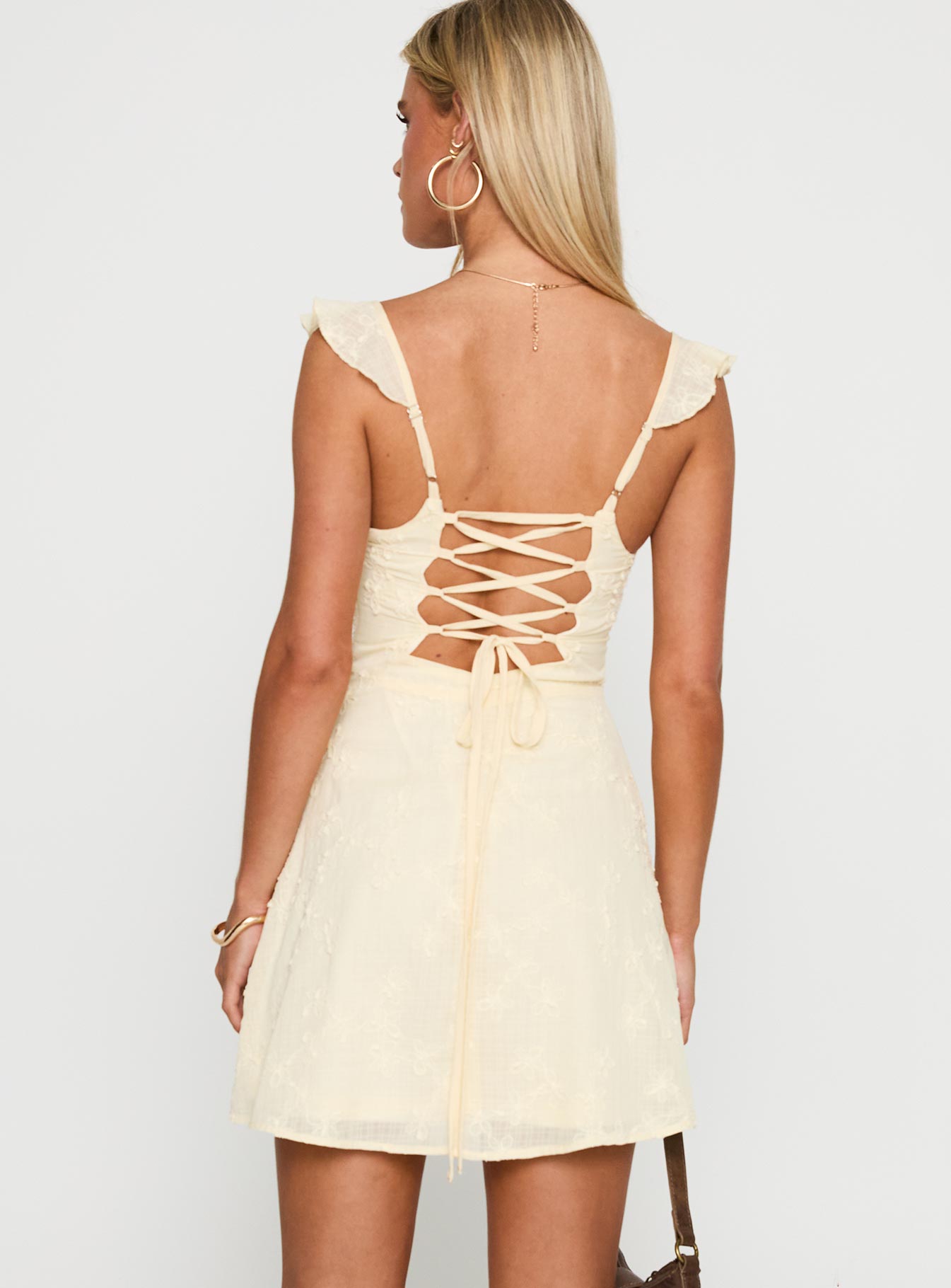 back view of model wearing Princess Polly Landon Mini Dress Lemon Sweetheart Neckline 