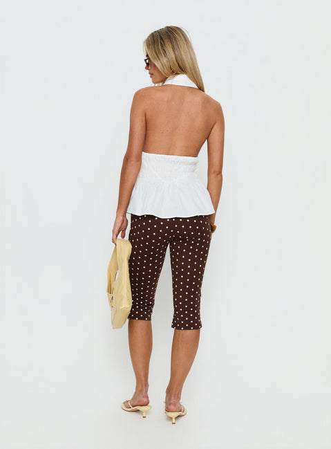 back view of model wearing Princess Polly Samaira Capri Pant Brown Polka Dot Mid Rise Pants 