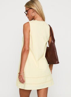 back view of model wearing Princess Polly Alanah Mini Dress Lemon Square Neck 