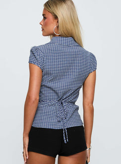 side view of model wearing Princess Polly Arianwyn Short Sleeve Shirt Navy Check Short Sleeves V-Neck 
