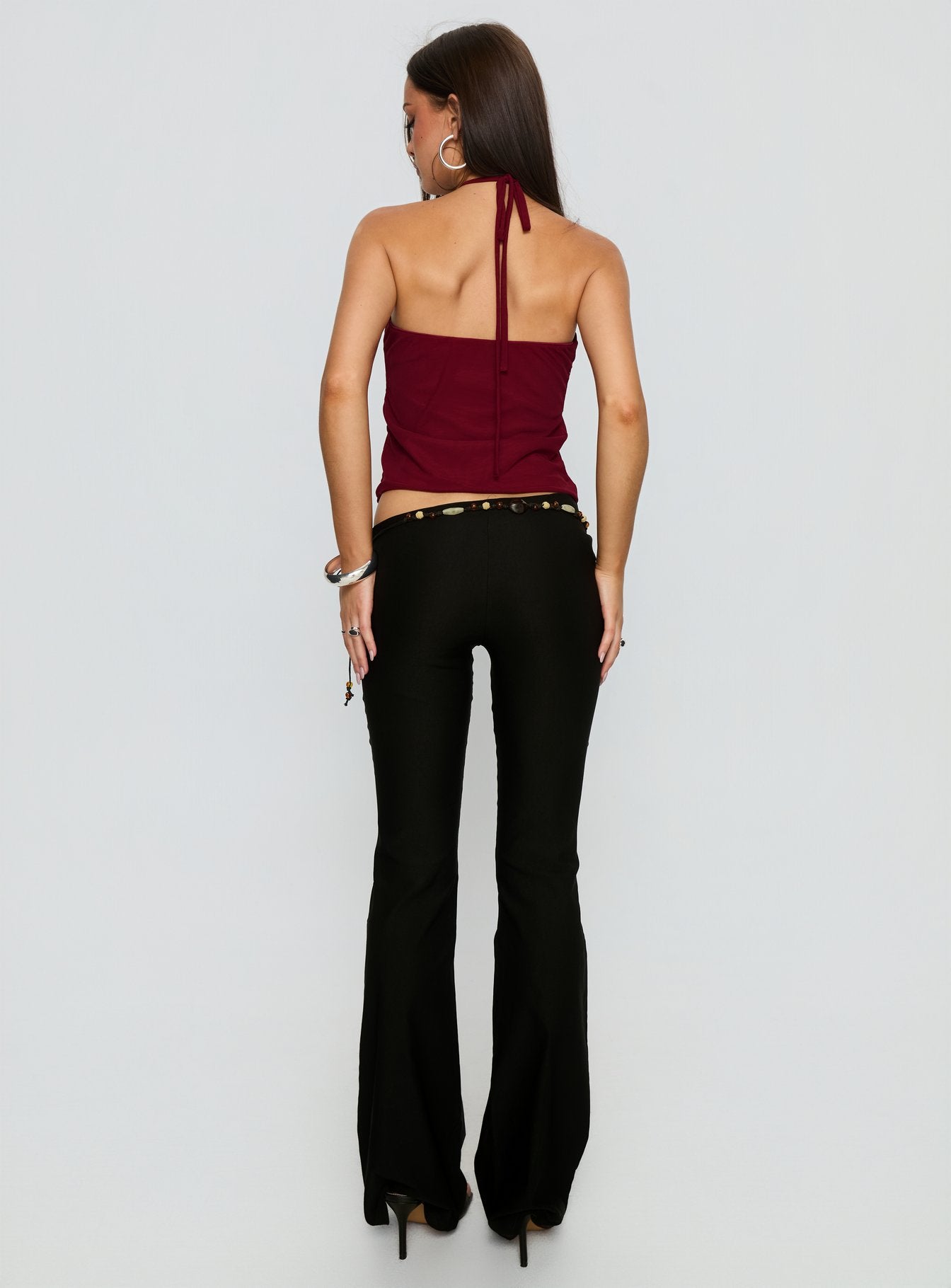 back view of model wearing Princess Polly Krislynn Button Belt Pants Black Mid Rise Pants 