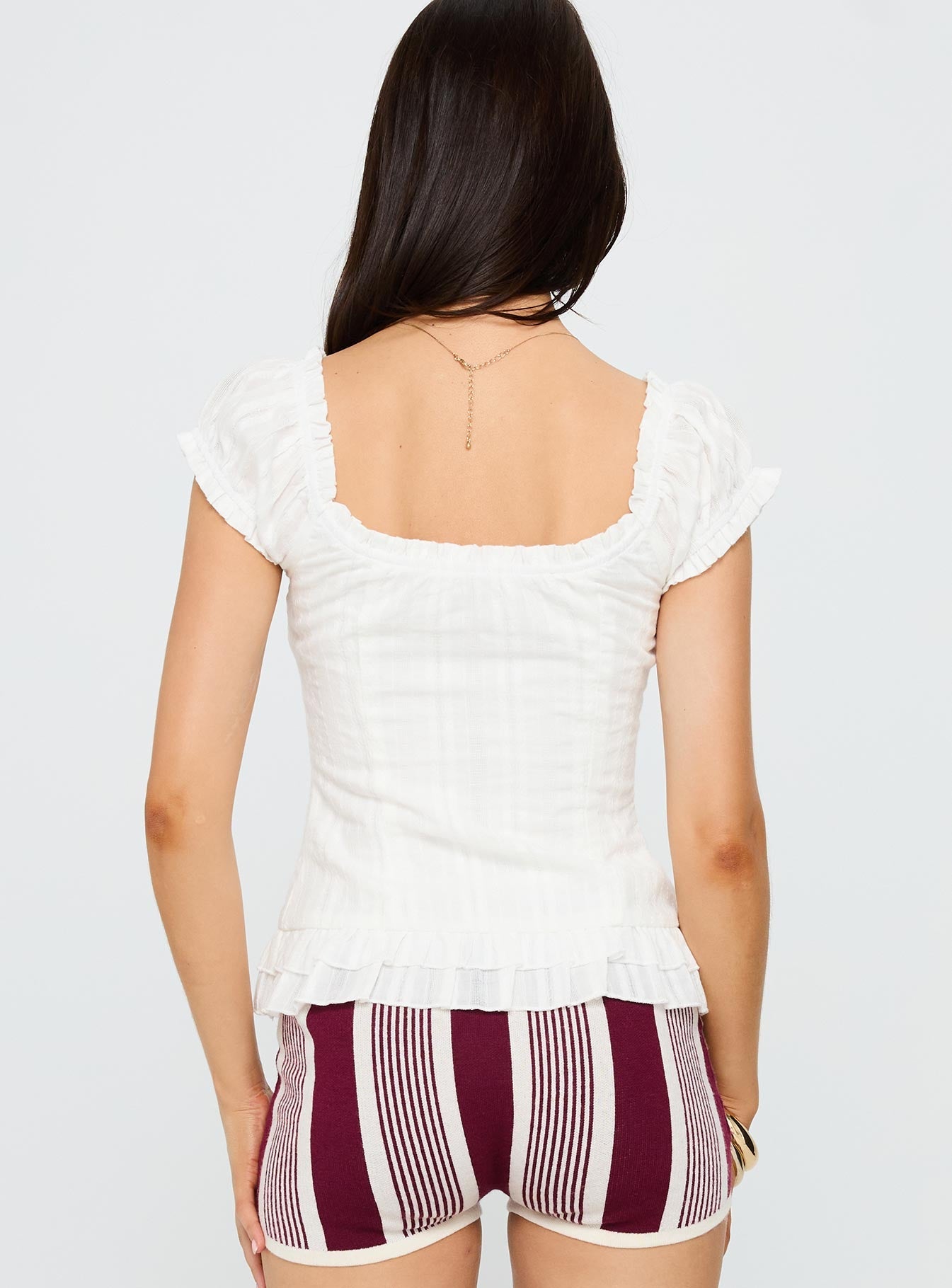back view of model wearing Princess Polly Suiter Frill Detail Top White Short Sleeves Sweetheart 