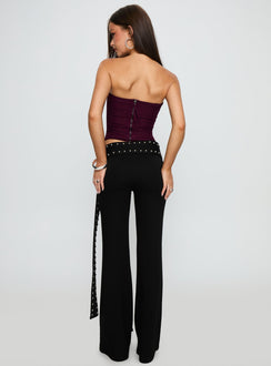 back view of model wearing Princess Polly Nikolia Studded Wrap Belt Pants Black Mid Rise Pants 