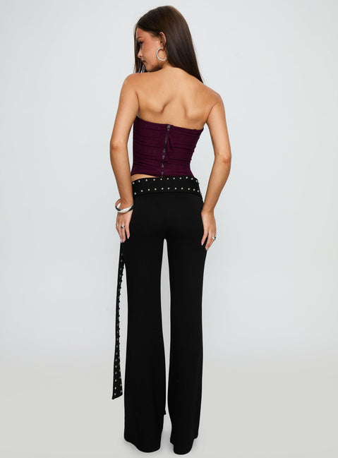 back view of model wearing Princess Polly Nikolia Studded Wrap Belt Pants Black Mid Rise Pants 