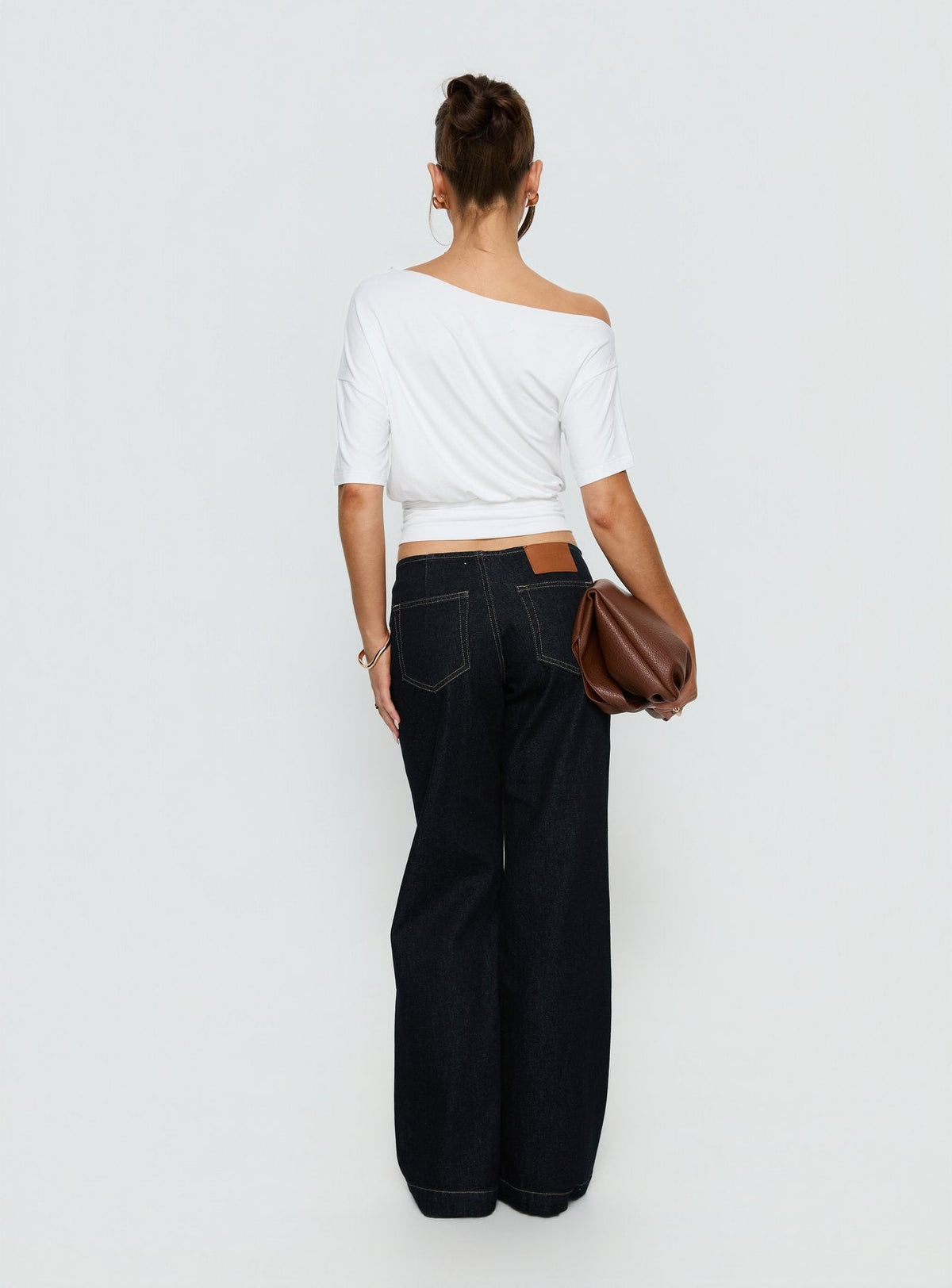 Presenting Buenos No Waist Low Rise Straight Leg Jeans Raw Denim Petite womens-jeans with belt and gold accent back view of model wearing Princess Polly