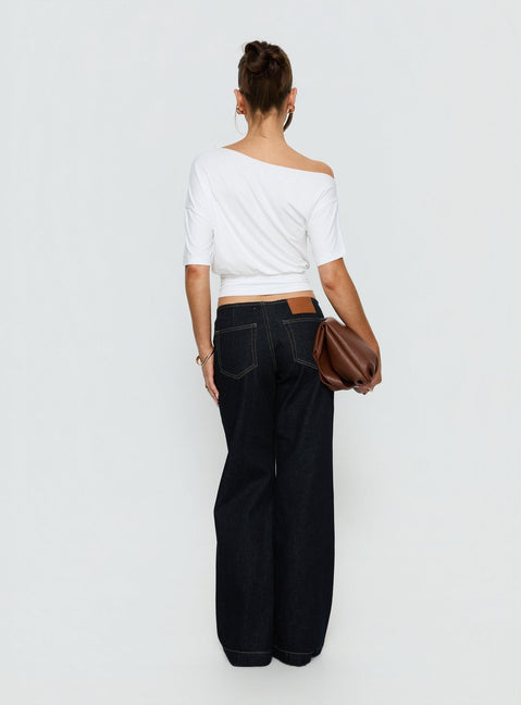 Presenting Buenos No Waist Low Rise Straight Leg Jeans Raw Denim Petite womens-jeans with belt and gold accent back view of model wearing Princess Polly