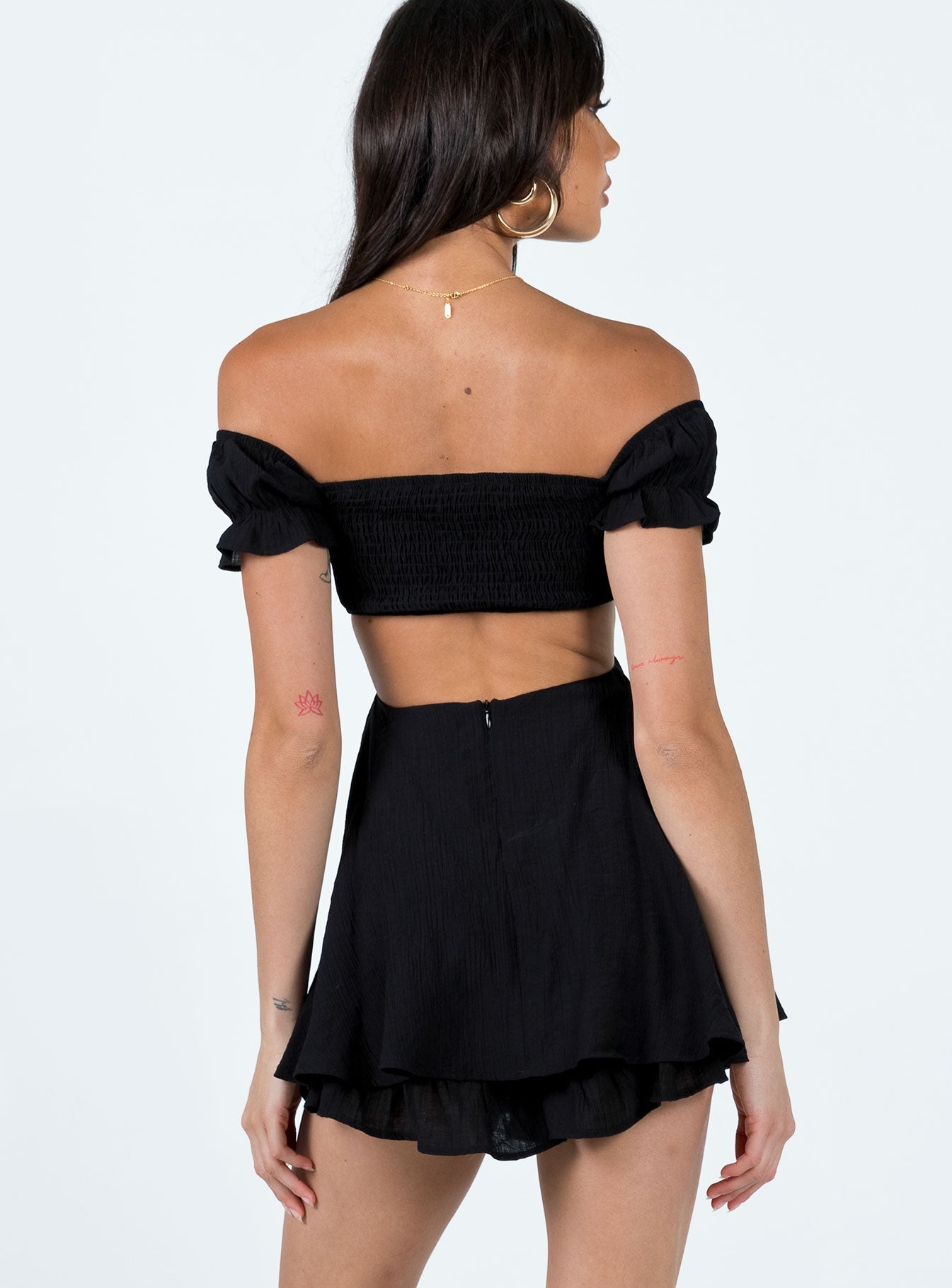 Romper Elasticated shoulders and neckline Shirred bust Can be worn on or off shoulder Cut out sides and back Layered ruffle hem Good stretch Lined 