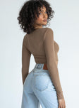 Long sleeve top Soft ribbed material Scooped neckline Gathered detail at bust Pointed front hem