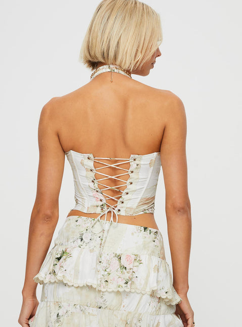 Floral halter neck corset Elasticated halter strap, lace up back with tie fastening, ruched bust, invisible zip fastening at side, boning throughout