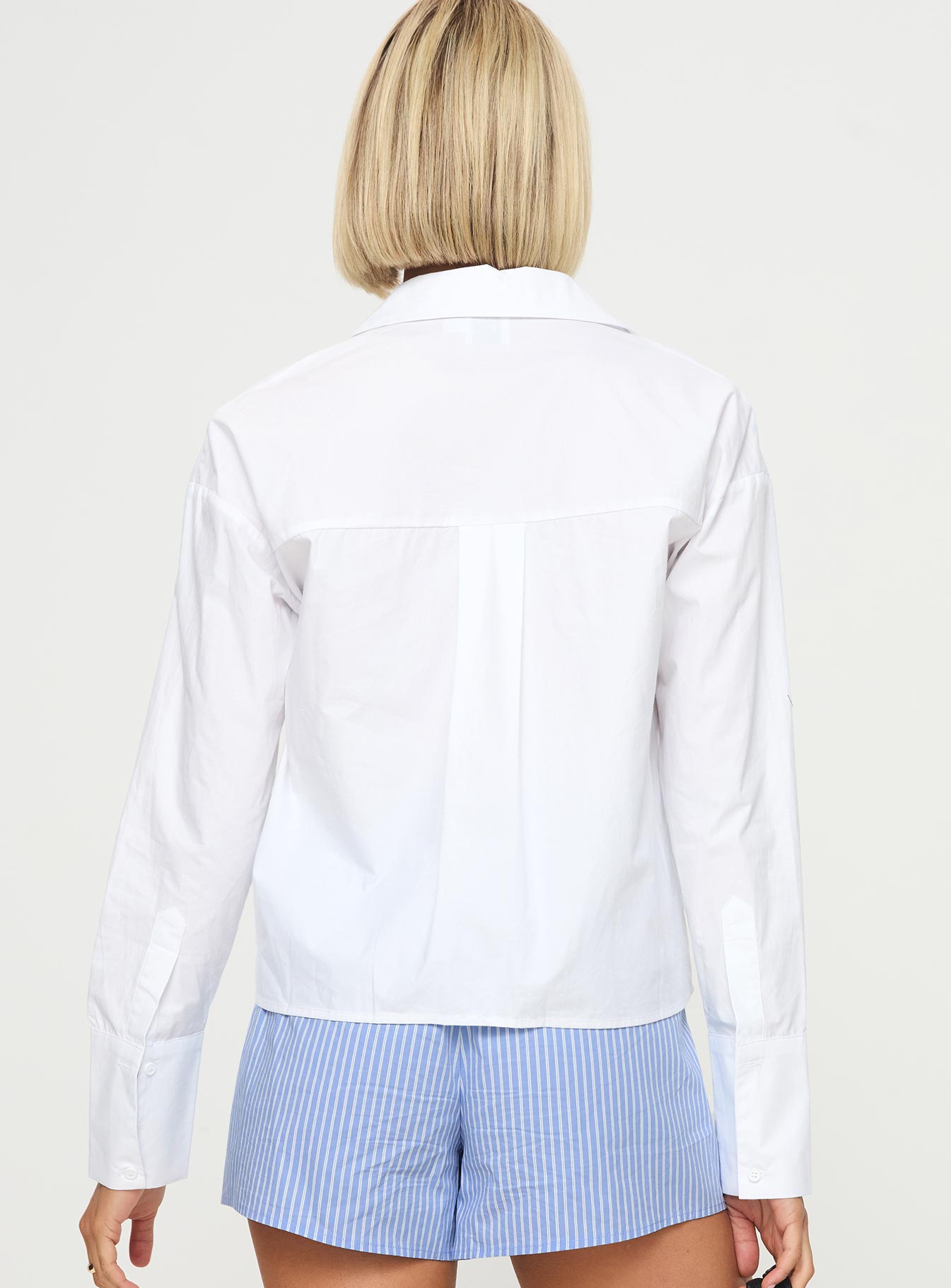 back view of model wearing Princess Polly Kellot Shirt White Full Sleeves V-Neck 