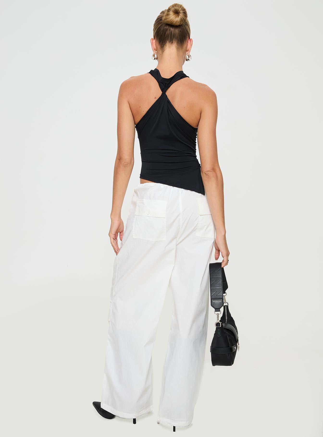 back view of model wearing Princess Polly Blessings Tie Front Cotton Pant White Low Rise Pants 