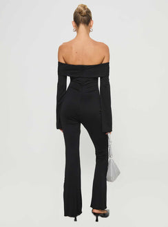Jumpsuit Off-the-shoulder style, inner silicone strip at bust, flared sleeves with split, frill detail at bust, flared leg Good stretch, fully lined  Princess Polly Lower Impact 