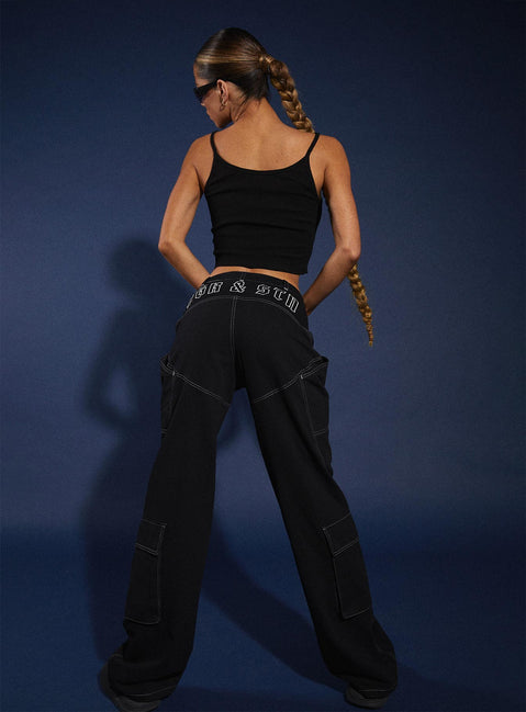 Front view of model wearing  front Princess Polly High Waisted Pants High Waisted Pants High Waisted Pants High Waisted Pants  JGR & STN  Christina Cargo Pant Black