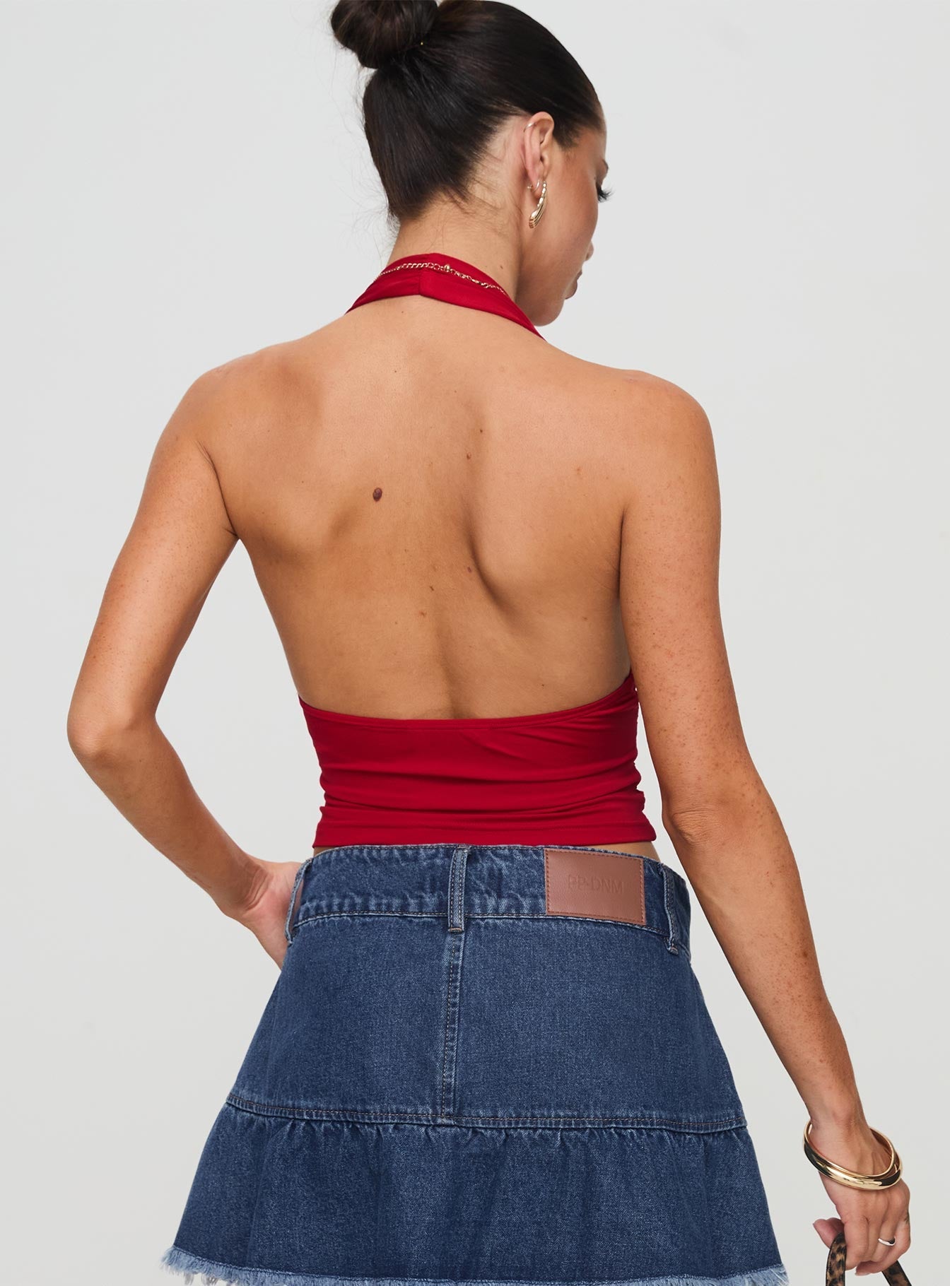 back view of model wearing Princess Polly Love Coast Top Red Sleeveless Plunger 