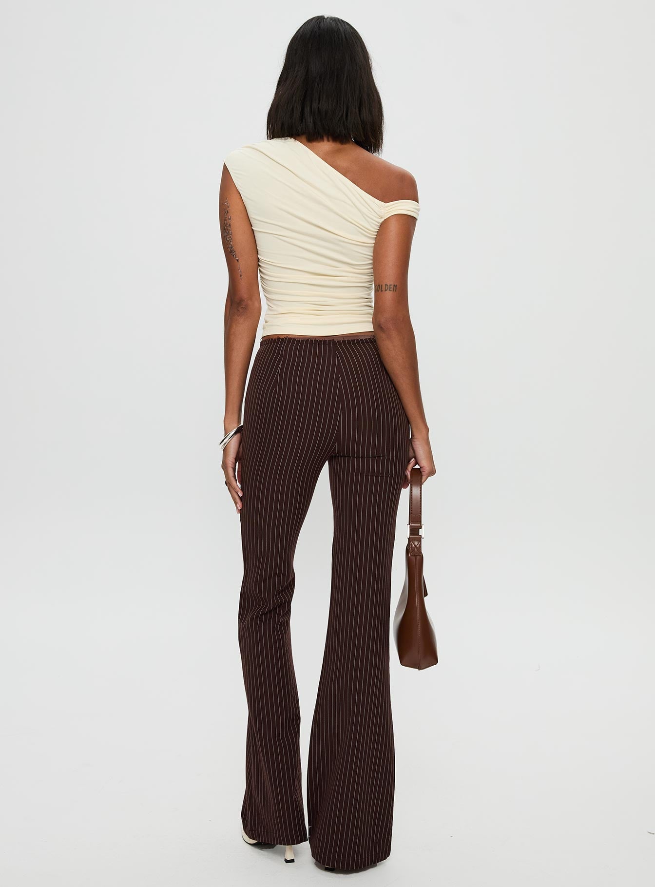 back view of model wearing Princess Polly Sportia Flare Pants Brown High Waisted Pants 