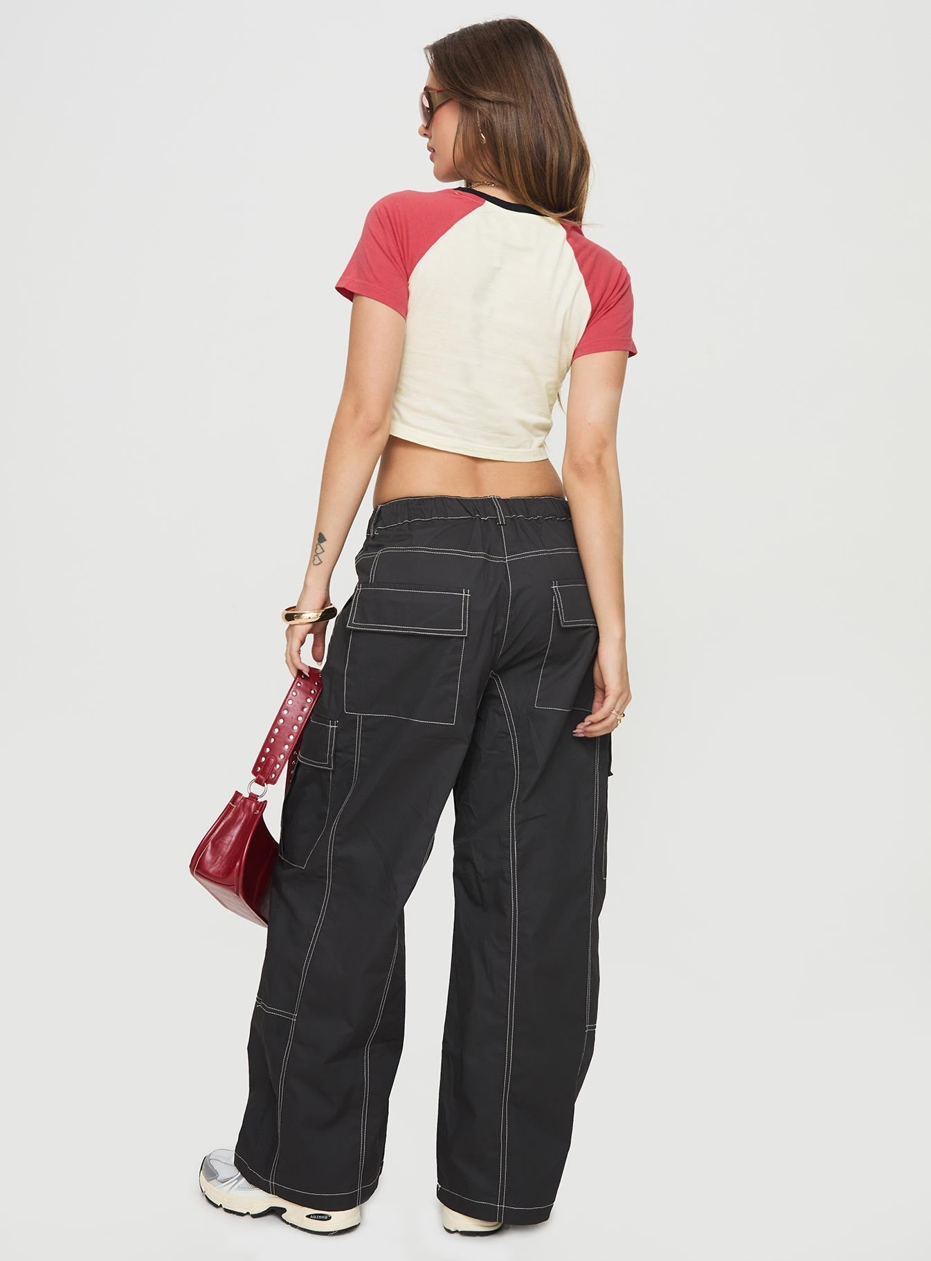 back view of model wearing Princess Polly Soria Cargo Pants Black Low Rise Pants 